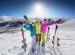 Female and male young people having skiing and snowboarding vacation on a snow slopes